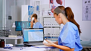 Medical woman physician checking treatment of diagnosed patients photo