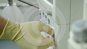 Medical worker adjusting and tuning artificial lung ventilation equipment in surgery. ventilator breathing system. Life