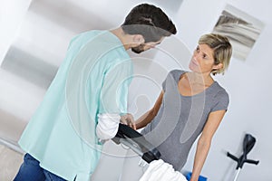 Medical worker in discussion with woman at home