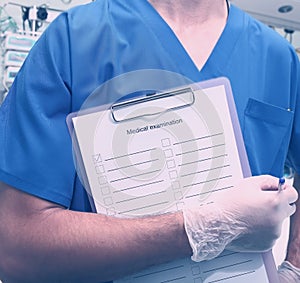 Medical worker whith clipboard in hospital photo