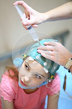 Medical worker will put electrode gel on the girls