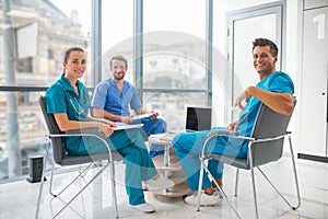 Medical workers having a changeover and looking positive