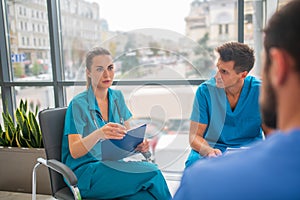 Medical workers having a changeover and talking