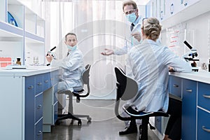 Medical workers talking in laboratory