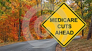 Medicare Cuts Ahead Caution Sign - Autumn Background