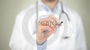 Medicare, Doctor writing on transparent screen