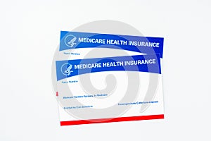 Medicare health insurance cards isolated on white photo