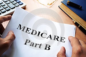 Medicare Part B on a desk. photo