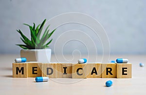 MEDICARE word made with building blocks, medical concept background photo