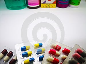 Medication and healthcare concept. Heap of colorful capsules med