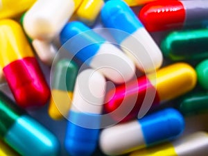 Medication and healthcare concept. Heap of colorful capsules med