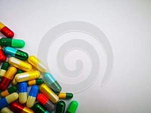 Medication and healthcare concept. Heap of colorful capsules med