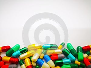 Medication and healthcare concept. Heap of colorful capsules med