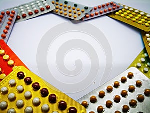 Medication and healthcare concept. Heap of colorful oral contraceptive drug in colorful blisters, for birth control. Abortion pro