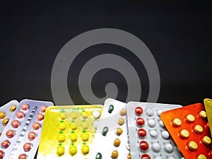 Medication and healthcare concept. Heap of colorful oral contraceptive drug in colorful blisters, for birth control. Abortion pro