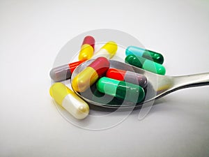 Medication and healthcare concept. Many colorful capsules of med