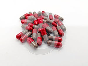 medication and healthcare concept. Many grey-red capsules of Flu