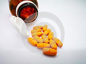 Medication and healthcare concept. Many oval orange tablets of P