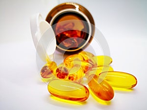 Medication and healthcare concept. Many oval yellow capsules of