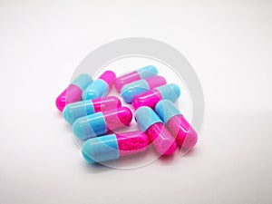 Medication and healthcare concept. Many pink-blue capsules of It