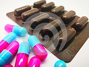 Medication and healthcare concept. Many pink-blue capsules of It