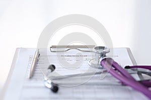 Medication history record form lying on table with stethoscope and silver pen. Medicine or pharmacy concept. Medical