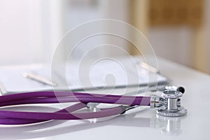 Medication history record form lying on table with stethoscope and silver pen. Medicine or pharmacy concept. Medical