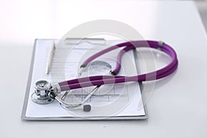 Medication history record form lying on table with stethoscope and silver pen. Medicine or pharmacy concept. Medical