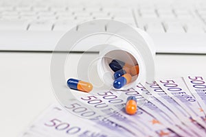 Medication Omeprazol, keyboard and 500 Euro notes