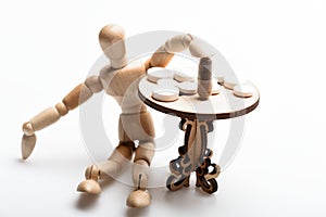 Medication regimen. Human wooden dummy near table with medicines. Tips tackling complex medication regimen. Take