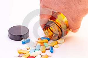 Medications in the form of pills and capsules on a white background