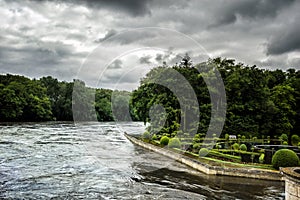 Medici garden and the river Cher. View through the window in the Chenonceau castle in France