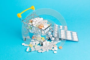 Medicinal antibiotic pills in shopping cart.