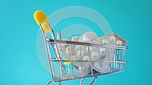 Medicinal antibiotic pills in shopping cart