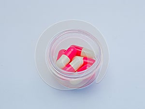 Medicinal capsules are red and White