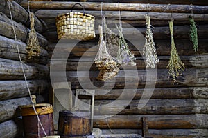 Medicinal herbs are dried in the interior of the summer kitchen of a wooden house built in 1912 in a Siberian village