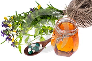 Medicinal herbs, honey, natural capsules and pills in medicine