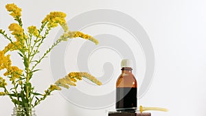 Medicinal oil on herbs, medicinal field flowers on an isolated white background. Homeopathy herbal treatment