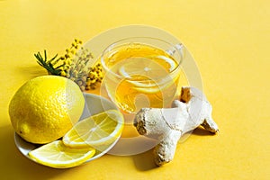 Medicinal tea in a cup, ginger, lemon, acacia-strengthen the immune system in cold season - flatly. Vitamin drink for health and