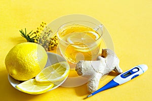 Medicinal tea in a cup, ginger, lemon, acacia-strengthen the immune system in cold season, thermometer  - flatly. Vitamin drink