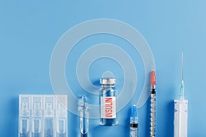 Medicine in ampoules with insulin, needles and syringes for medical subcutaneous injection