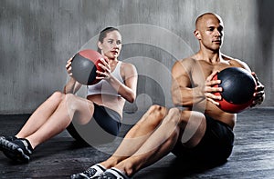 Medicine ball, health and fitness people doing bodybuilding workout, core muscle strength and gym performance. Exercise