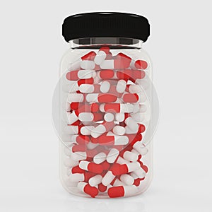 Medicine bottle with capsules isolated on white background.