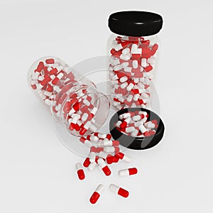 Medicine bottle with capsules on white background.