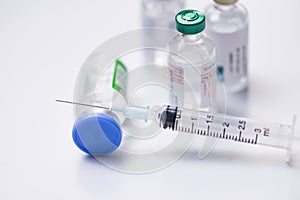 Medicine bottles glass for syringe injection needle on white background - Medication drug bottle equipment medical tool for nurse photo