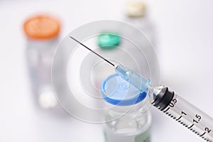 Medicine bottles glass and syringe injection needle on white background - Medication drug bottle equipment medical tool for nurse