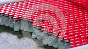 Medicine bottles production line at pharmaceutical factory. Medical bottles