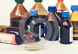 Medicine bottles on white background with copy space for text, retro concept closeup