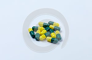 Medicine capsule on white background. Scattered capsules medicine