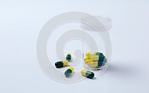 Medicine capsule on white background. Scattered capsules medicine